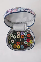 Bluefig Quilter Deluxe Combo bag set in blue floral exterior; features 19-inch wheeled bag and colorful thread spools.
