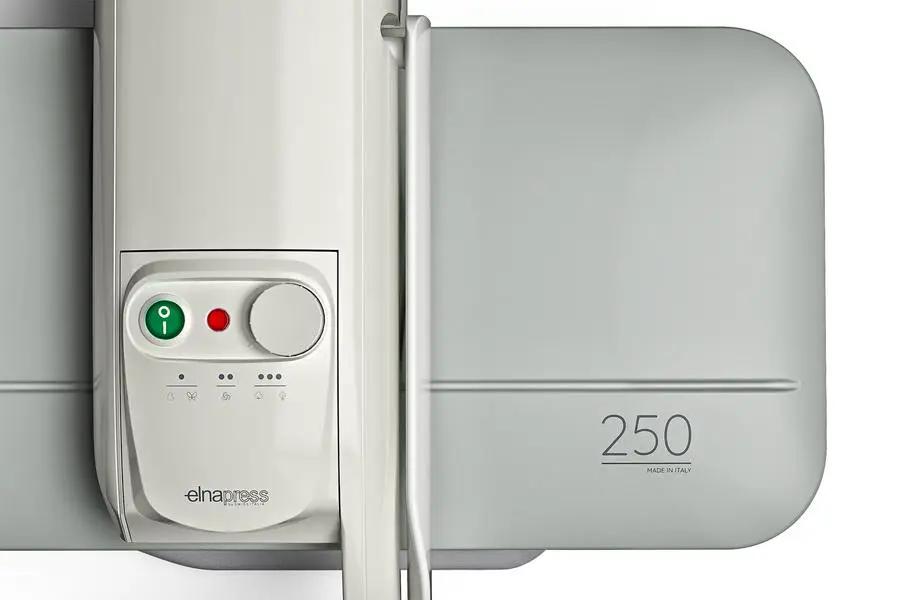 Elnapress EP250 steam press with white body, gray pressing plate, control panel featuring green power button and Elna logo.