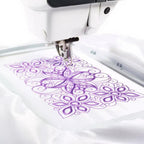 Sew Tech embroidery hoop 240mm x 150mm PA502 on white fabric with a purple floral design