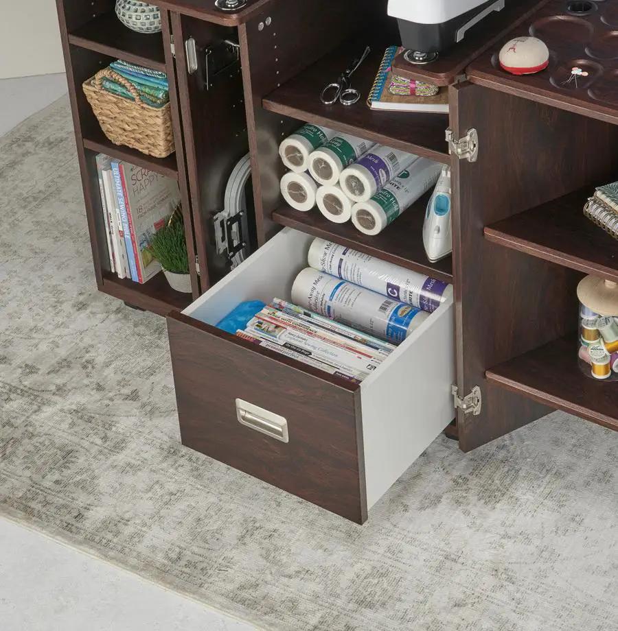 Sewing cabinet Koala Heritage in teak with open shelves and a wide pull-out drawer.