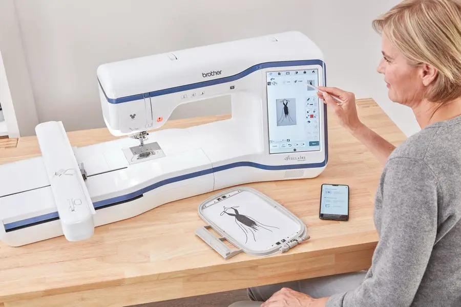 Brother Stellaire Innov-is XE1 Embroidery Machine, white with blue accents and touchscreen display