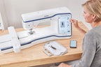 Brother Stellaire Innov-is XE1 Embroidery Machine, white with blue accents and touchscreen display