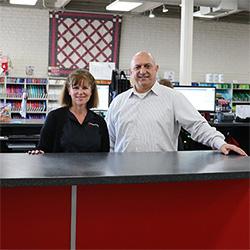 A man and women standing for customer service
