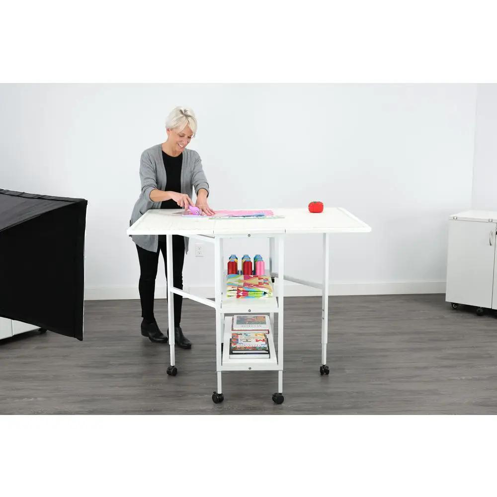 Arrow White Dixie Adjustable Cutting Table on wheels with lower shelf storage