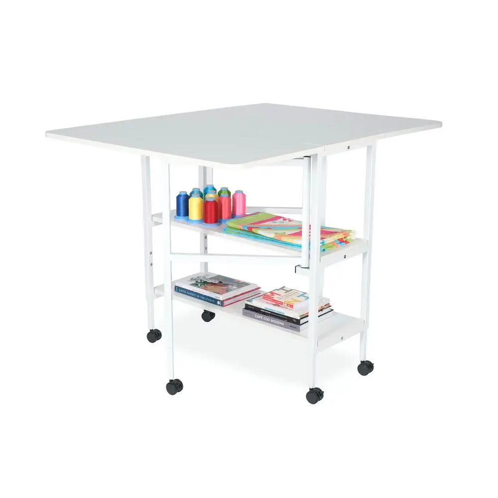 Arrow White Dixie Adjustable Cutting Table with caster wheels and gray top.