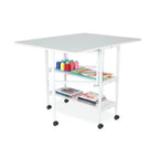 Arrow White Dixie Adjustable Cutting Table with caster wheels and gray top.