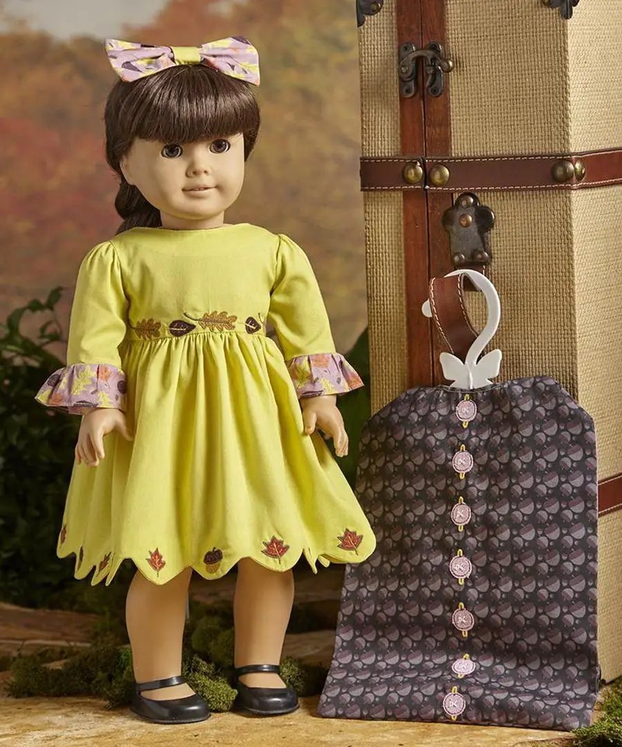 DIME Embroidery Designs: Dollicious Fall Fashions doll in a lime green dress with leaf embroidery and bow.