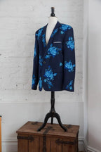 Navy blazer with bright blue floral embroidery on mannequin
