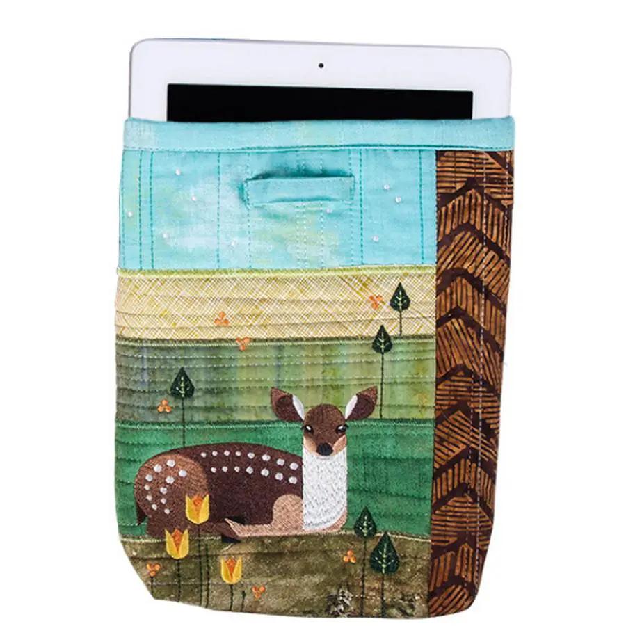 Anita Goodesign Landscape Animals sewing pattern; quilted tablet sleeve with deer in turquoise and green landscape.