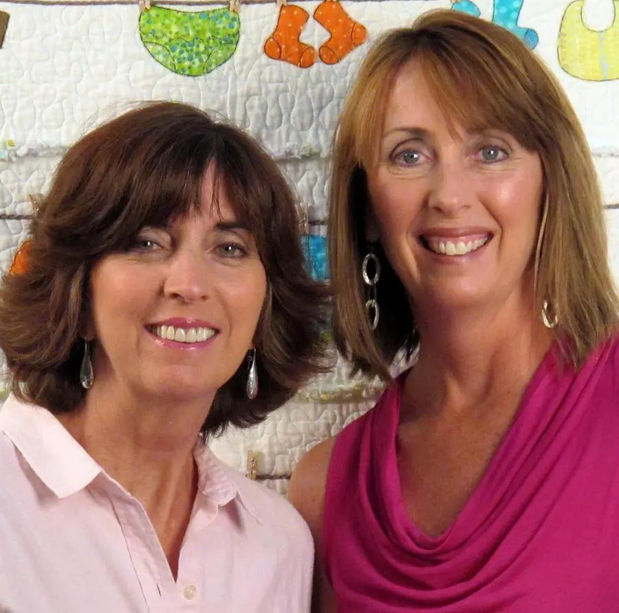 DIME Hoop It Up book promo: two smiling women in pink outfits pose in front of a quilt backdrop.
