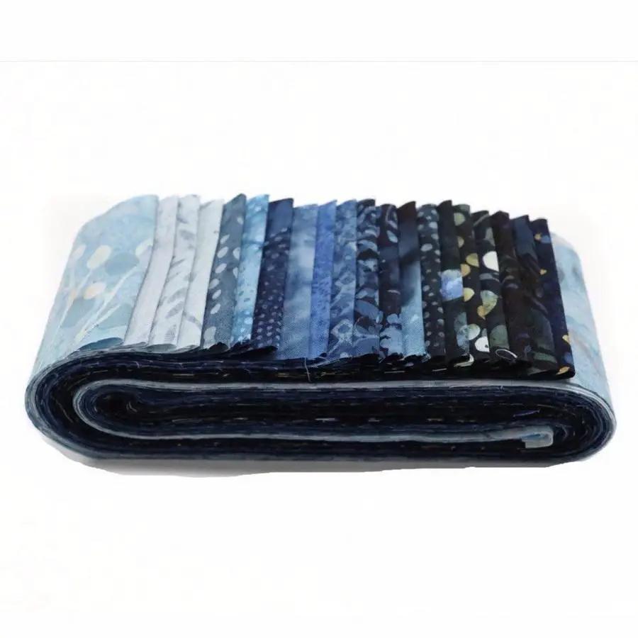 Fabric kit: A Quilter's Dream Rockin Rail Fence blues fabric bundle, rolled.