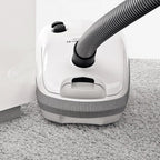 SEBO AIRBELT E3 Premium canister vacuum in Arctic White with corrugated hose