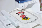 Brother Stellaire Innov-is XJ1 sewing and embroidery machine with Minnie Mouse embroidery on hoop
