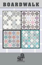 Boardwalk quilt kit by Cindi McCracken Designs featuring Bali Poppy Noir fabric strips across four color-block panels