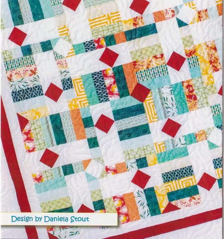Fabric kit: Cozy Quilt Designs Drop Diamonds Quilt; colorful quilt top with red diamonds and teal/orange blocks.