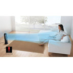 Dyson Hot+Cold Jet Focus Fan AM09, black, delivering focused blue airflow across living room toward a seated person.