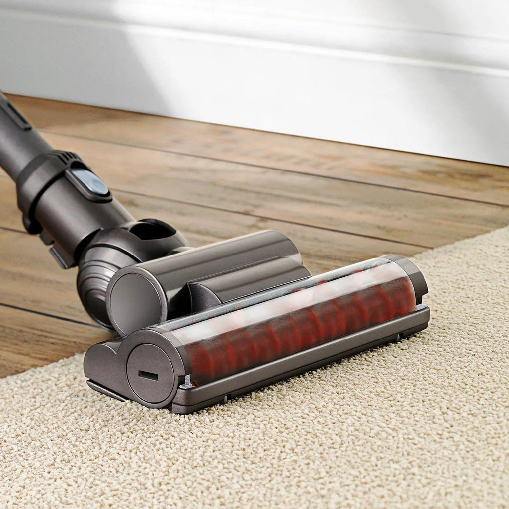 Dyson Ball Multi Floor canister vacuum DC39 with grey body and red brush roller on beige carpet