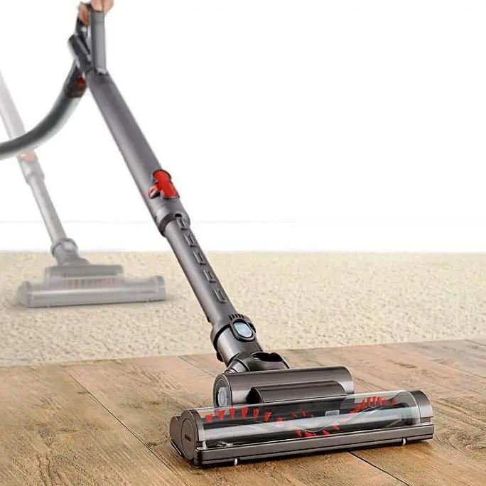 Dyson Ball Multi Floor Canister Vacuum DC39 on hardwood floor with gray body and long wand.