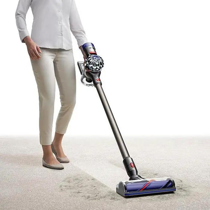 Dyson V8 Animal vacuum cordless stick; gray body with purple cyclone and blue floor head