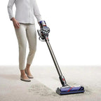 Dyson V8 Animal vacuum cordless stick; gray body with purple cyclone and blue floor head
