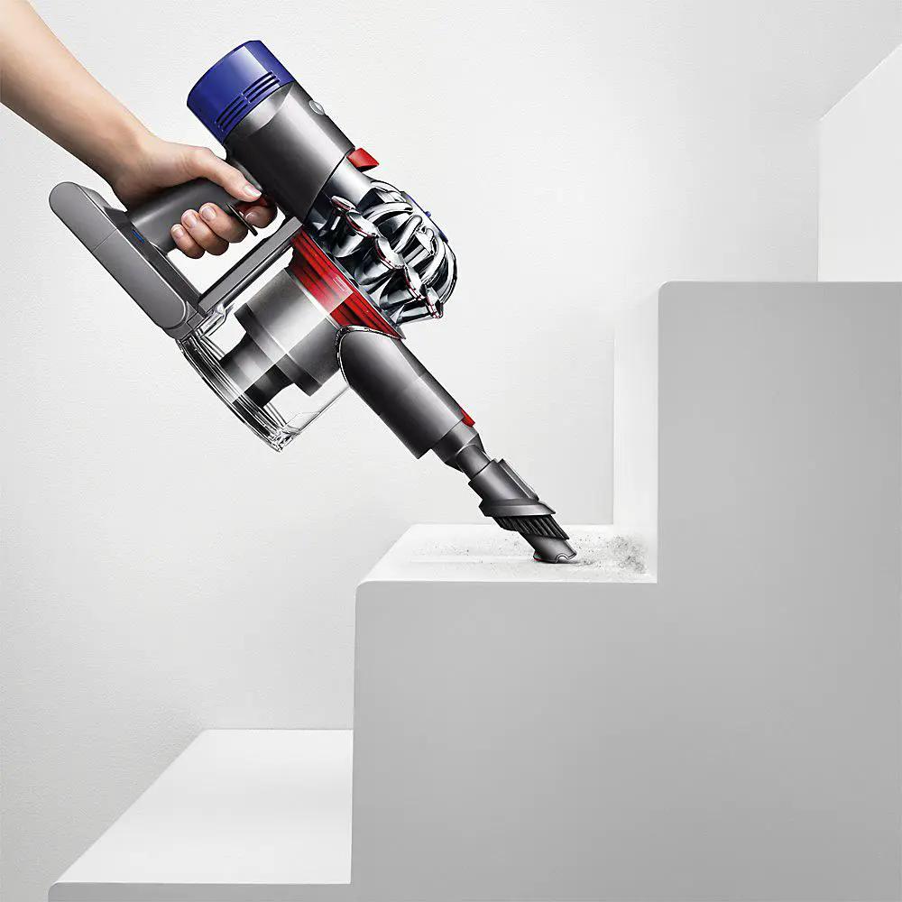 Dyson V8 Absolute SV10 cordless vacuum cleaner with bottom-release dust cup in dark gray and blue.