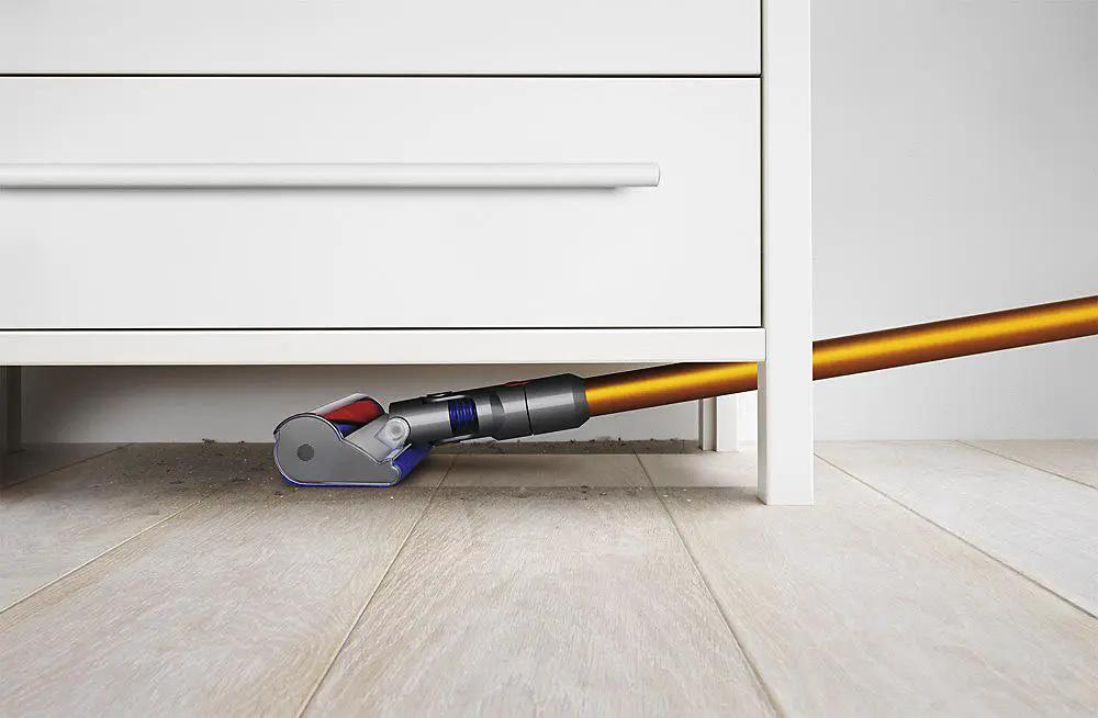 Dyson V8 Absolute SV10 vacuum; orange wand, gray-blue head, bottom-release dust cup.