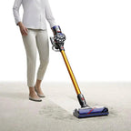 Dyson V8 Absolute cordless stick vacuum with orange wand and blue floor head.