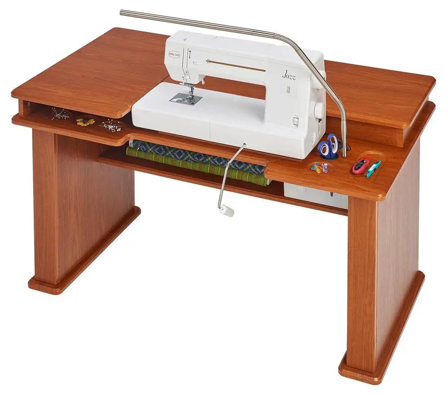 Koala Studios Sewing Station Cabinet in teak finish with a white sewing machine and storage shelf.