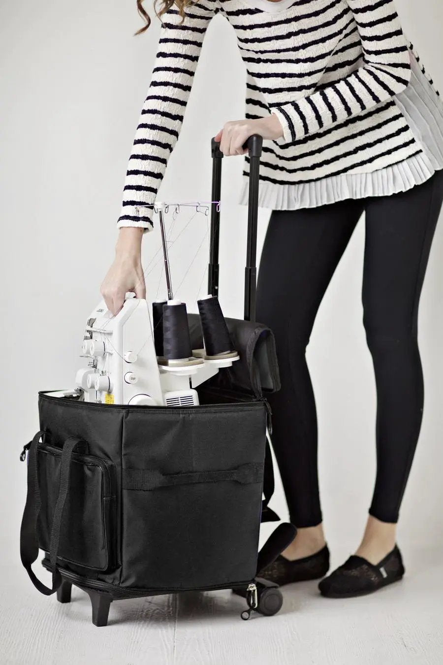 Bluefig STB-M wheeled serger bag (Medium) - black with a white serger inside, on wheels.