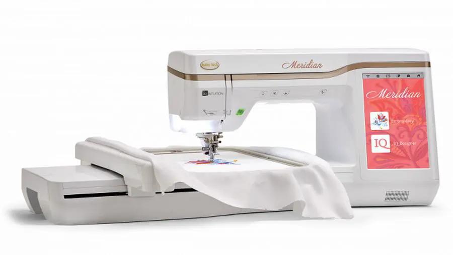 Baby Lock Meridian embroidery machine, white body with pink Meridian panel.