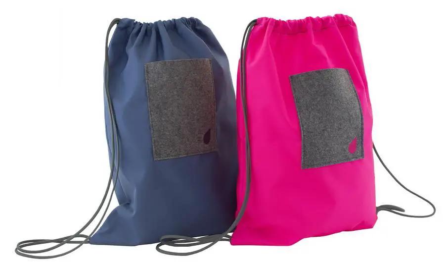 Bluefig University Learn to Sew Kit: two fabric drawstring bags in blue and pink with gray front pockets