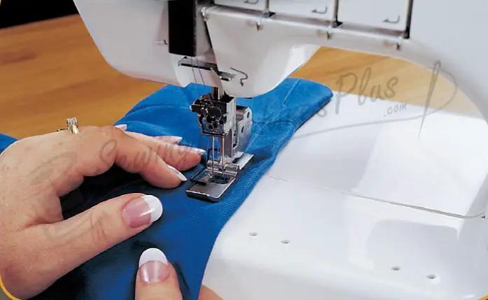 Janome 1000CPX Cover Pro coverstitch machine sewing blue fabric