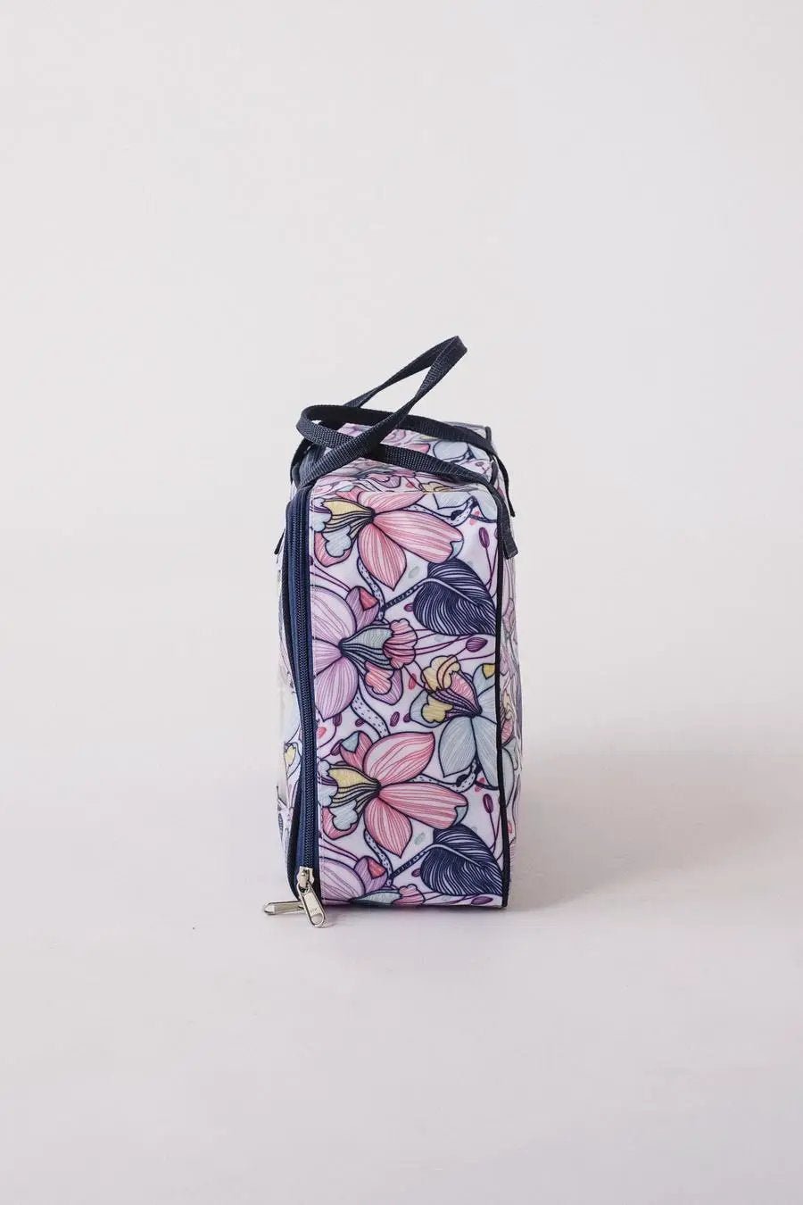 Bluefig Quilter Deluxe Combo bag in floral purple-pink print with navy trim and zipper