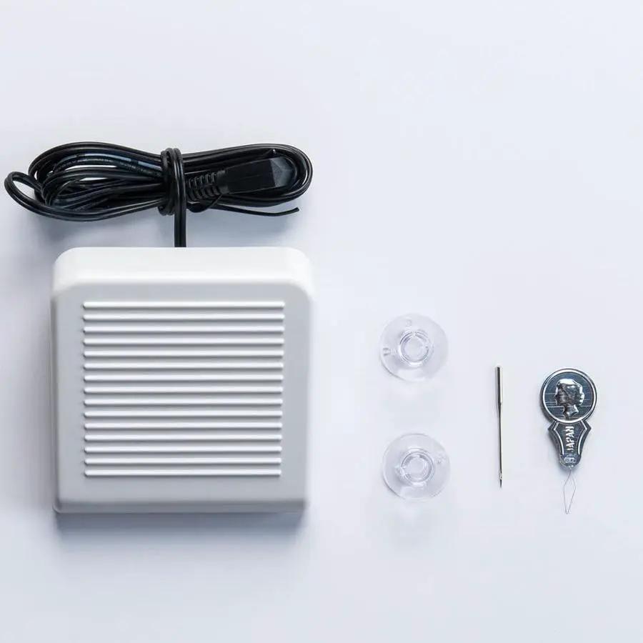 Janome Derby Line portable sewing machine accessory kit with white foot pedal, power cord, spool caps, needle tool