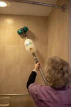 Bissell BGCC1000 floor machine with dual brushes in use on tiled bathroom floor