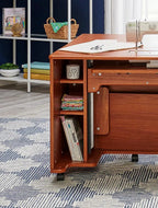 Koala Heritage Cub Sewing Cabinet in teak finish with sewing machine on top and open storage shelves