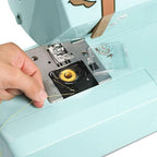EverSewn Sparrow 30S sewing machine in teal with extension table