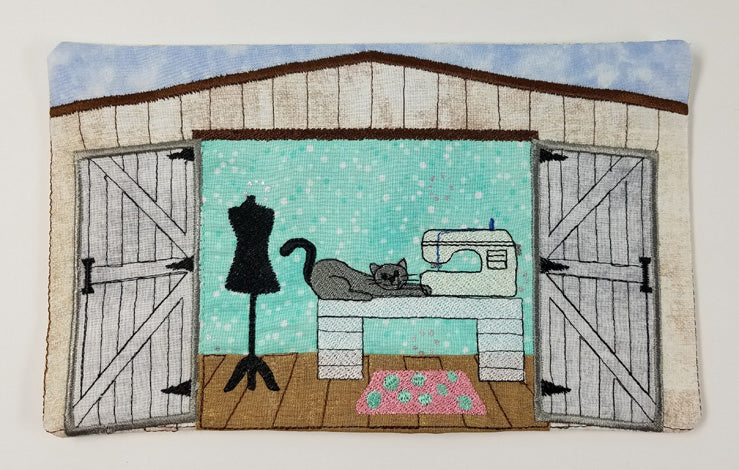 Design of  Cat on table with a sewing machine