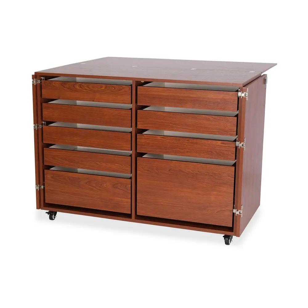 Kangaroo Sewing Furniture teak sewing cabinet with two doors and multiple drawers on casters.