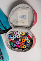 Bluefig Designer Series Pearl Mini Carry Case, pink exterior with multicolor thread spools inside