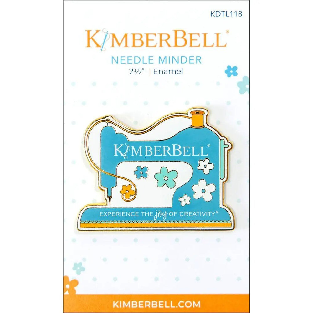 KimberBell needle minder, enamel blue sewing-machine design with flower motifs for needle storage and travel