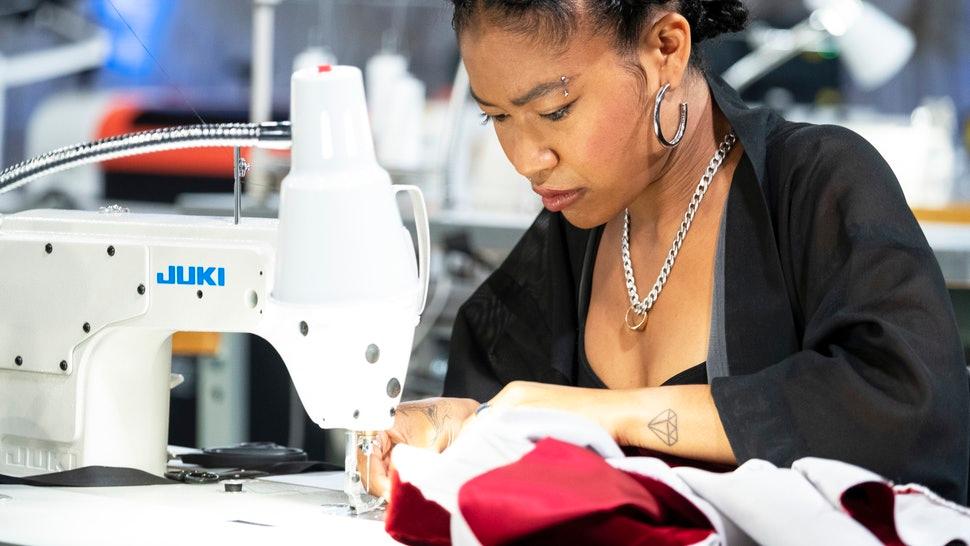 A women is working on a Juki Sewing machine