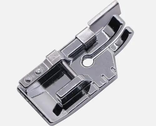 A polished 1/4" patchwork low-shank quilting foot with guide