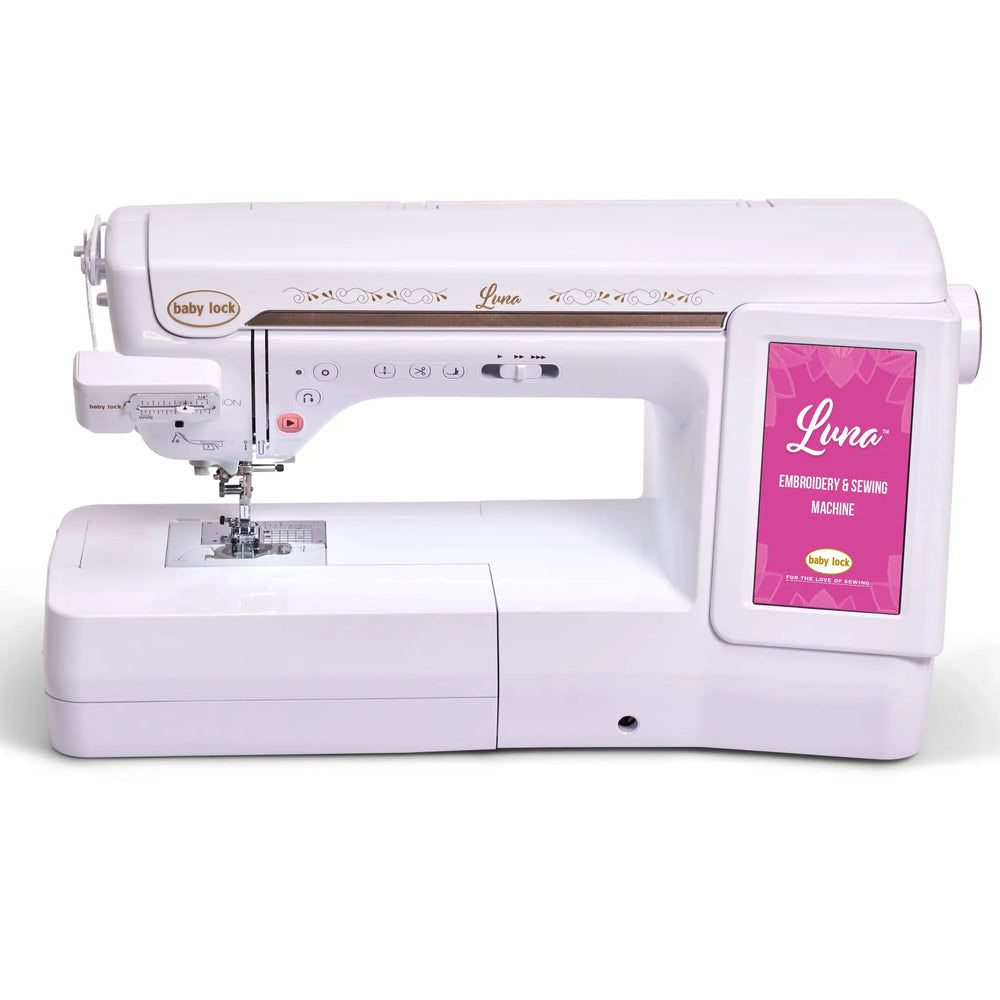 Baby Lock Luna sewing and embroidery machine, white with gold accents and a pink display panel