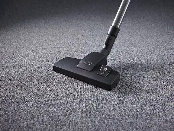 Miele Classic C1 Pure Suction Canister Vacuum, graphite grey, on carpet