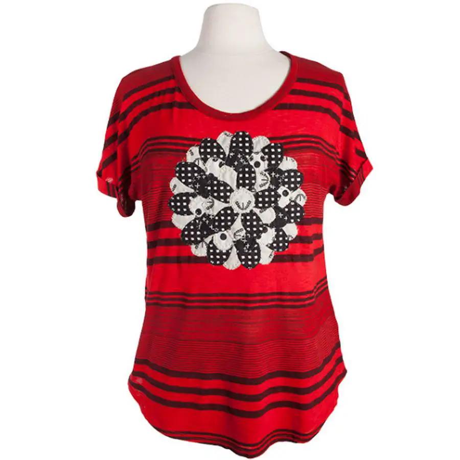 Anita Goodesign Blanket Stitch Animals sewing pattern; red striped top with a black-and-white circular floral motif.