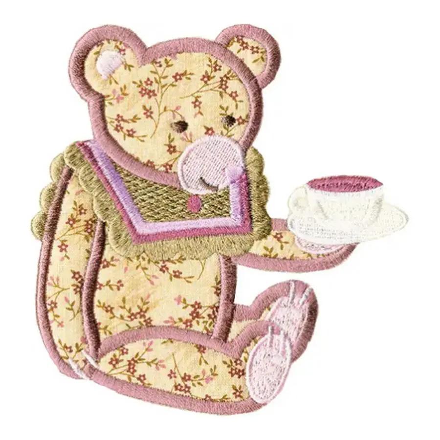 Anita Goodesign Baby Tea Party embroidery design: floral beige teddy bear with pink trim holding a teacup.