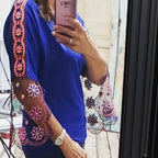 Touch of Lace top by Angela Wolf; blue blouse with pink floral lace sleeves, accompanied by a floral tote bag.