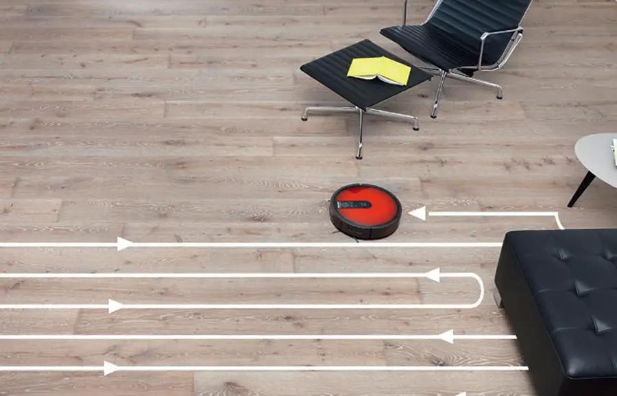 Miele Scout RX1 red robot vacuum on hardwood floor