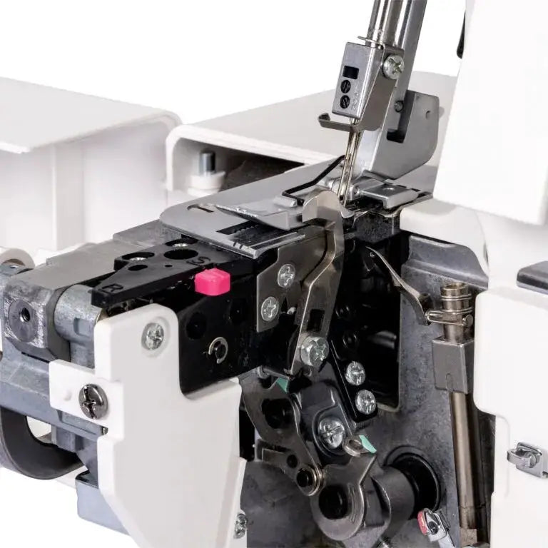 Janome MyLock 454D serger machine internals; white exterior with metal threading and needle mechanism.